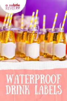 waterproof drink labels are lined up on a table with drinks in small jars and paper straws sticking out of them