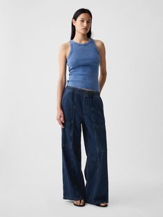 Fit: A full-length high rise jean that's loose throughout.  Finishes with a relaxed wide leg.  Fabric: 95% Cotton, 5% Recycled Cotton.  Stretch: No Stretch Jeans.  Authentic denim that gets better with every wear.  Made to wear all day & break in over time. ​ Rise: High Rise Skirt.  Look: A loose wide-leg utility jean in a dark indigo wash.  Details: Elasticized waist, front slant pockets, side cargo pockets, & back patch pockets.  Responsibly Made: This pair of jeans is part of our water-saving High Rise Skirt, Streetwear Accessories, Model Inspo, Loose Fit Jeans, Dark Indigo, Break In, Denim Outfit, High Rise Jeans, The Gap