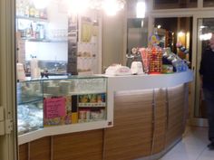 a man standing in front of a counter filled with food