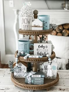 a three tiered tray with christmas decorations on it