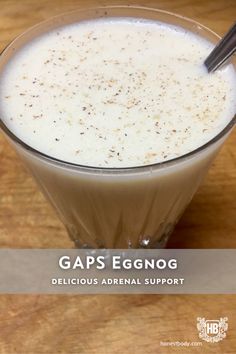 an eggnog drink in a glass on a wooden table with the title gap's eggnog delicious adrenal support