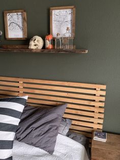 a bed with two wooden shelves above it