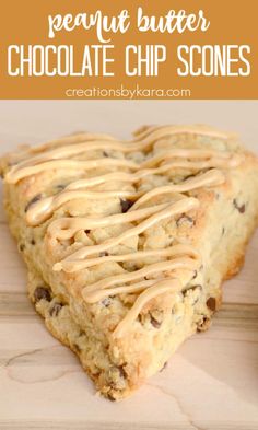 chocolate chip scones with peanut butter drizzled on top and in the shape of a heart