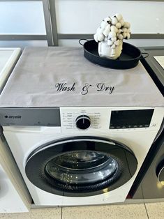 a washer and dryer sitting next to each other