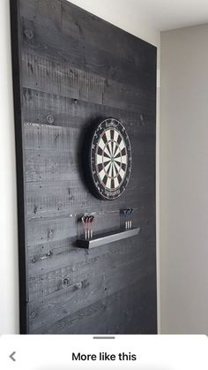 a dart board mounted to the side of a wall