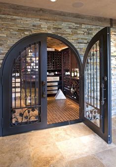 an open door to a wine cellar filled with bottles