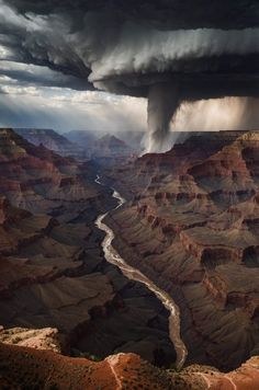 a large storm is coming over the grand canyon