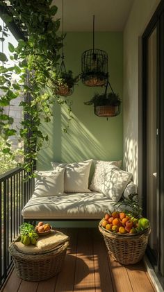 a porch with two wicker baskets filled with fruits and vegetables on the floor next to a white couch