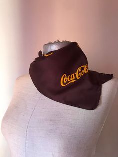 "Super rare advertising brown/orange Coca Cola squared neck scarf, featuring the classic logo and orange can prints. I guess that you have never seen a chocolate brown scarf from the Coke company before and that you have never heard that there were a scarf made by the well-known Italian (more specifically from Como lake) scarf factory of Gentilucci Really, how cool is that? There is also the small golden embossed date clamp label of the Italian designer that certifies it! The date of production Vintage Square Scarf Gift, Vintage Square Scarves For Gift, Vintage Square Scarves As Gifts, Vintage Square Scarves As Gift, Vintage Scarves As Gift, Vintage Rectangular Scarves For Gift, Como Lake, Brown Scarf, Brown Scarves