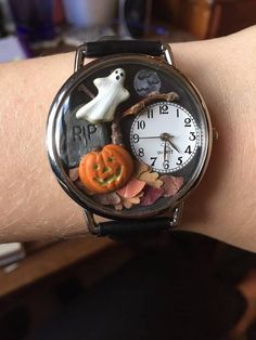 a wrist watch with halloween decorations on it