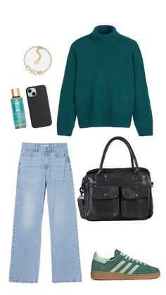 a green sweater, jeans and handbag are on display