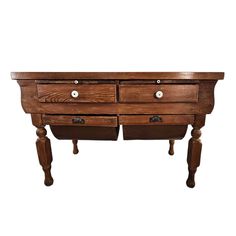 an old wooden table with two drawers on one side and three smaller drawers on the other