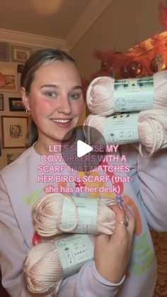 a woman holding three balls of yarn in front of her face and the caption reads,