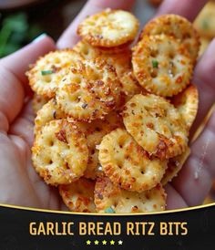 a person holding some crackers in their hand with the caption garlic bread ritz bits