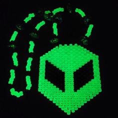 glow in the dark stickers are shown on a black surface, with green dots surrounding them