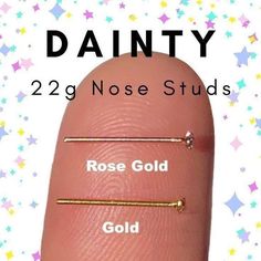 dainty nose studs with rose gold and gold barbell rings on the thumb