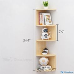 the corner shelf has three shelves on each side and two vases with plants in them