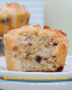 a muffin sitting on top of a white plate next to a bottle of milk