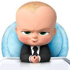 the boss baby is sitting in front of a table with his hands on his chest