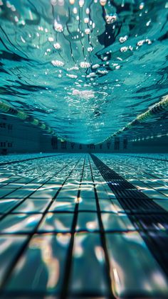 an underwater swimming pool with clear water and sunlight reflecting off the surface on the floor