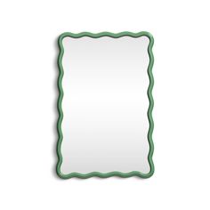 an empty green frame on a white wall