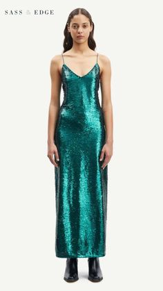 With a shaped V neckline, back hem slit, and invisible side seam zip for added comfort, this dress is perfect for any special event. Pair with the silver Eva sandals and dazzle in incomparable beauty. Green Sequins