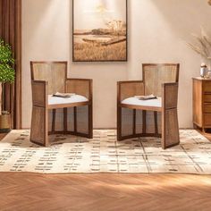 two wicker chairs sitting on top of a wooden floor next to a table with a potted plant