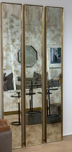 a room with three mirrored doors in it