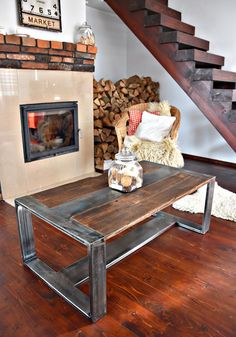 a living room with wooden floors and a fire place