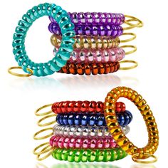 several different colored bracelets stacked on top of each other