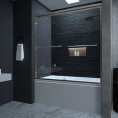 a black and white bathroom with a glass shower door