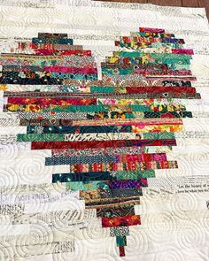 a close up of a quilt on a table