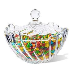 a glass bowl filled with lots of candy