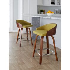 two wooden stools with yellow upholstered seat covers in a white kitchen area