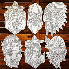 four paper cut outs depicting native american women with headdress and feathers on them