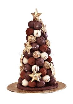 a christmas tree made out of chocolates and candies on a white background royalty images