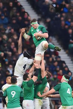 a group of men playing rugby against each other