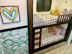 the bunk beds are decorated with colorful designs