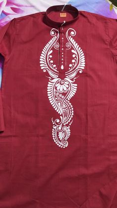 a red shirt with white designs on it