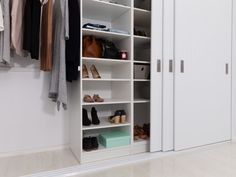 an organized closet with shoes and handbags