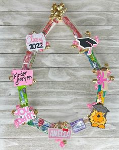 a wreath made out of school supplies on top of a wooden table with the word class spelled