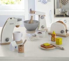 a kitchen scene with focus on the mixer and other items that are being used to make food