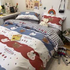 a bed with two teddy bears on it in a room next to a desk and chair