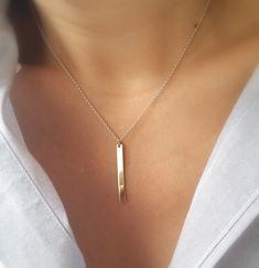 Simple, sleek and unique. This two tone sterling silver chain and 14k gold fill bar necklace can pretty much go with any outfit. This design is a great dress up dress down piece that can easily become your everyday necklace. 14k gold bar is 30 mm x 3 mm. Rollo sterling silver chain and 14k gold fill spring ring clasp. Please make sure to select your desired length in the drop down menu. Model is wearing a 15 inch necklace. Your necklace will arrive in a small jewelry gift box with bow. Sterling Silver Bar Necklace For Everyday, Sleek Simple Jewelry Gift, Sleek Simple Jewelry As Gift, Modern Bar Necklace For Everyday Wear, Minimalist Sterling Silver Bar Necklace With Rectangular Pendant, Modern Sterling Silver Bar Necklace, Minimalist Gold Bar Necklace For Everyday, Dainty Sterling Silver Bar Necklace For Everyday, Minimalist Everyday Gold Bar Necklace