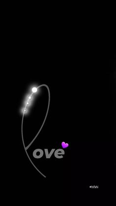 a black background with the word love written on it and a lit up heart in the middle