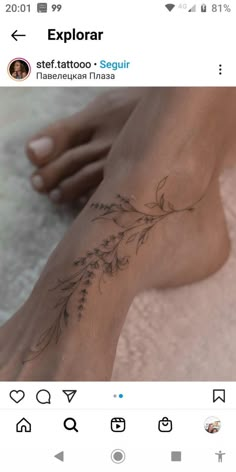 a woman's foot with flowers on it and the word explore written in black ink