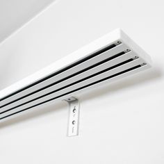 a white radiator is hanging on the wall