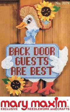 the back door guests are best sign is made out of cross - stitch fabric and has sunflowers on it