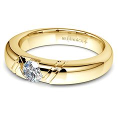 a yellow gold wedding ring with a single diamond