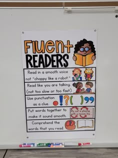 a sign that is on the wall in front of some writing and reading materials for fluent - readers